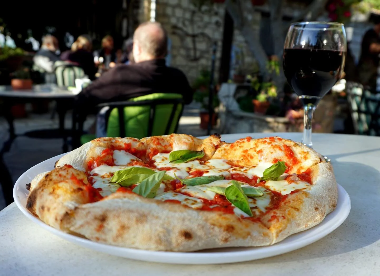 Tomato, mozzarella and basil pizza with a charred crust